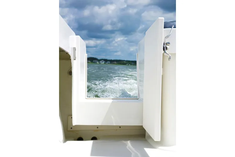 Slide: The Image of Manufacturer Provided Image: View from Parker 2320 Sport Cabin 2019 boat, open door to ocean waves. - 26