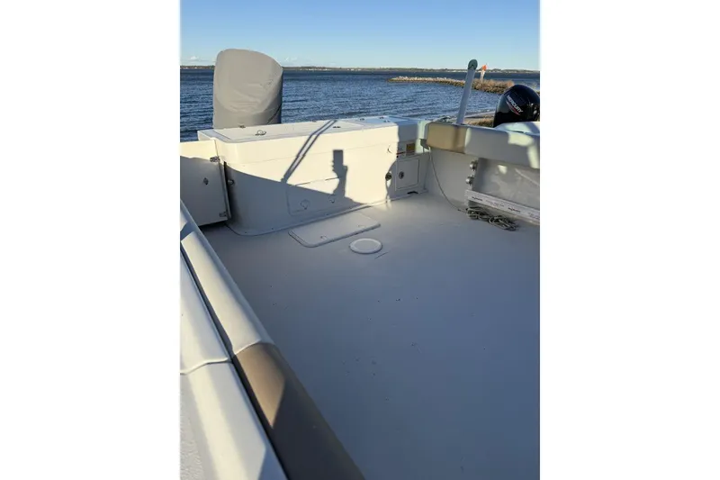 Slide: The Image of 2019 Parker 2320 Sport Cabin interior with steering wheel and Garmin navigation system. - 4