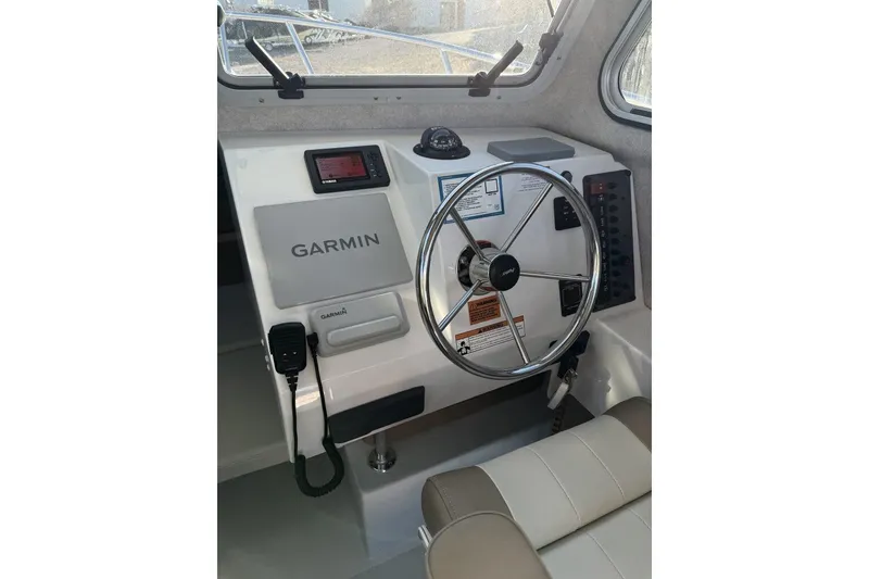 Slide: The Image of 2019 Parker 2320 Sport Cabin boat windshield view with wiper and hatch. - 7