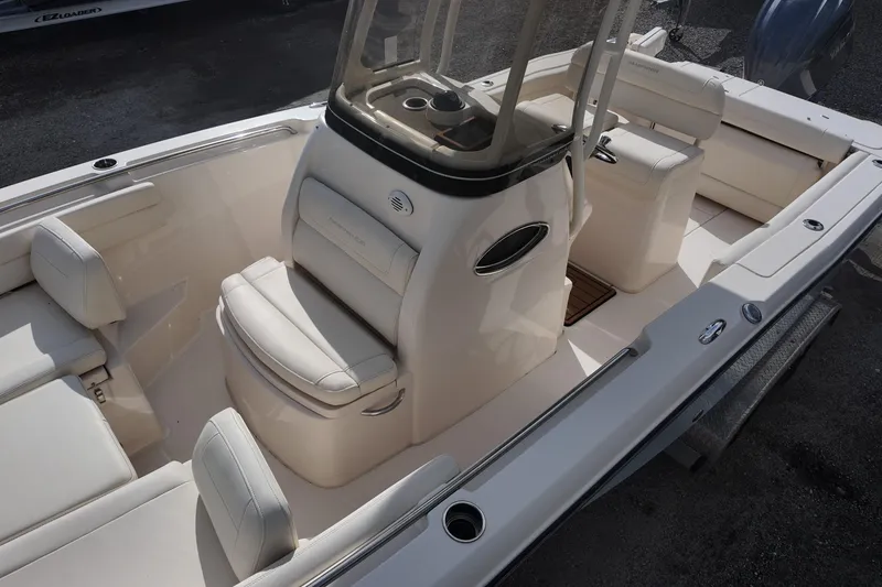Slide: The Image of 2023 Grady White Fisherman 236 boat interior with white seating and console. - 10