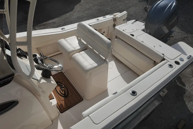 Slide: The Image of 2023 Grady White Fisherman 236 boat interior with seating and steering wheel. - 11