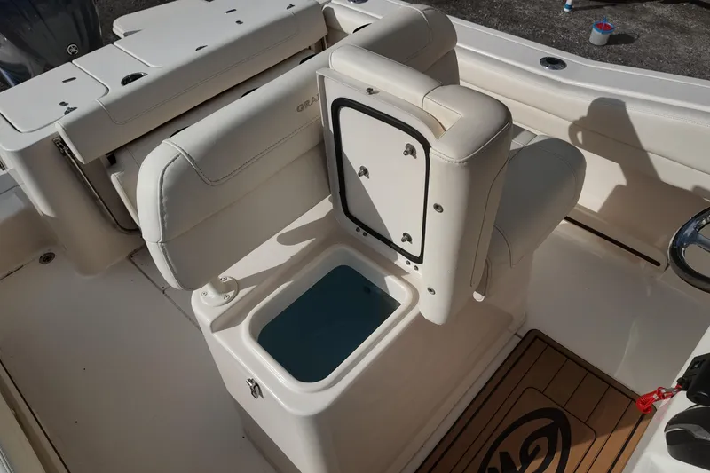 Slide: The Image of 2023 Grady White Fisherman 236 boat interior with open storage compartment. - 12