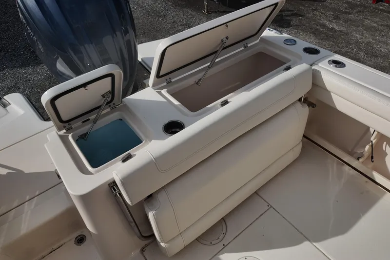 Slide: The Image of 2023 Grady White Fisherman 236 boat interior with open storage compartments. - 15