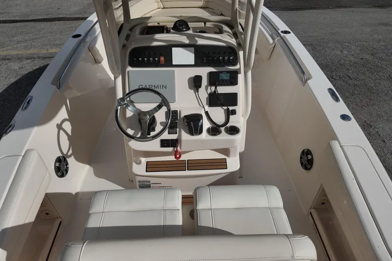 Slide: The Image of 2023 Grady White Fisherman 236 boat cockpit with Garmin navigation system. - 17