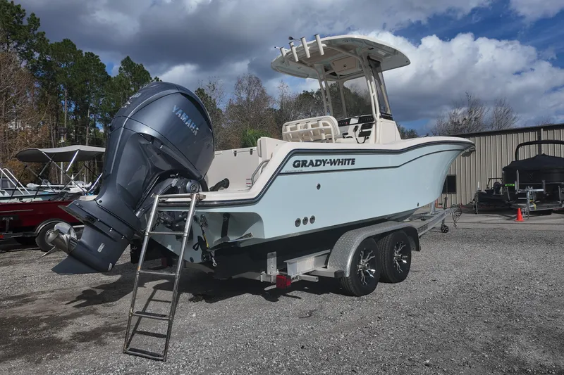 Slide: The Image of 2023 Grady-White Fisherman 236 boat with Yamaha engine on trailer, outdoors. - 4