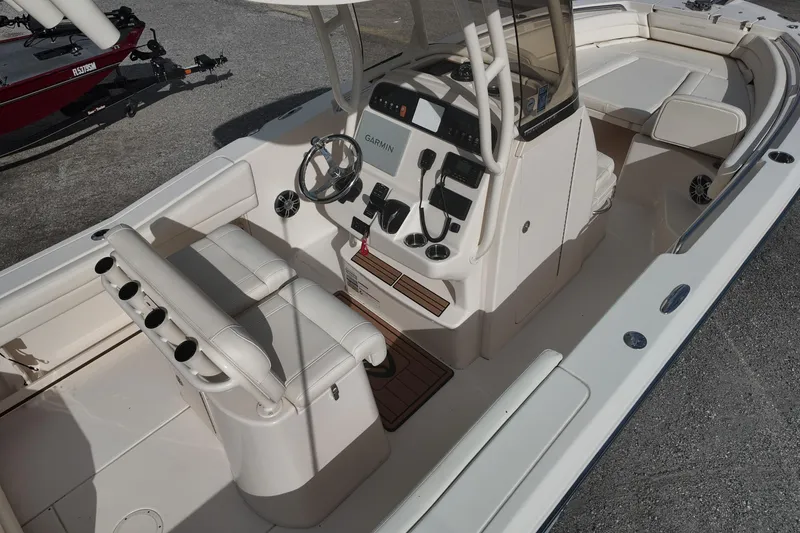 Slide: The Image of 2023 Grady White Fisherman 236 boat interior with steering console and seating. - 6