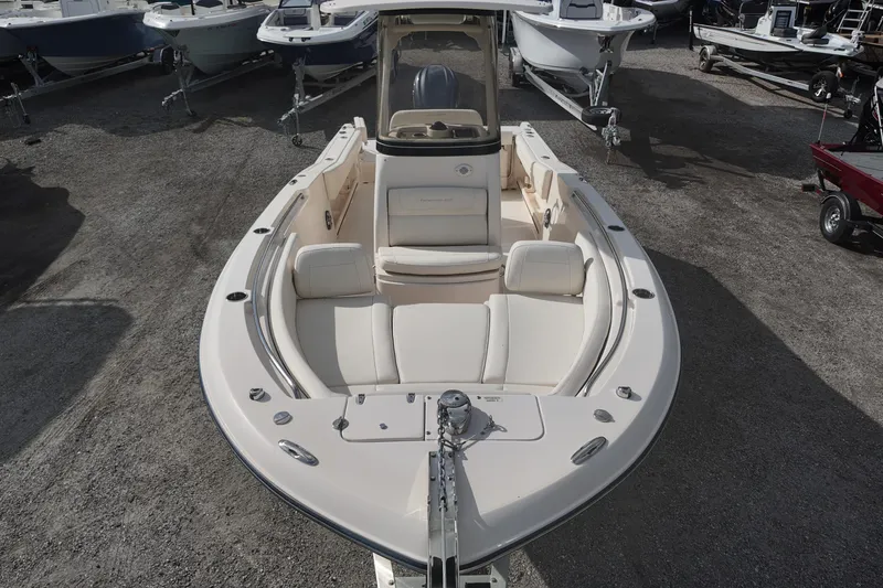 Slide: The Image of 2023 Grady White Fisherman 236 boat with spacious seating, displayed in a showroom. - 9
