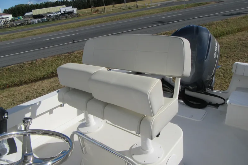 Slide: The Image of 2022 Parker 2300 Special Edition boat with white seating and Yamaha engine. - 16