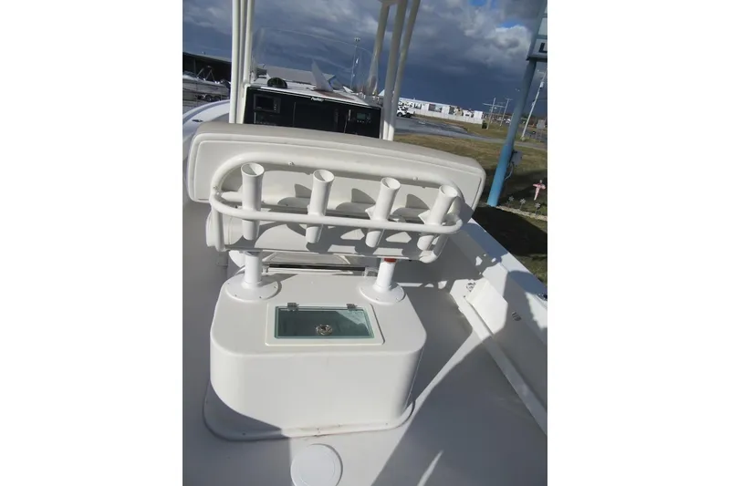 Slide: The Image of 2022 Parker 2300 Special Edition boat interior with rod holders and storage compartment. - 17