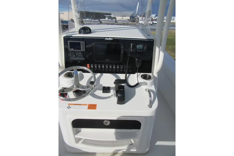 Slide: The Image of Control panel of 2022 Parker 2300 Special Edition boat with steering wheel and navigation equipment. - 19