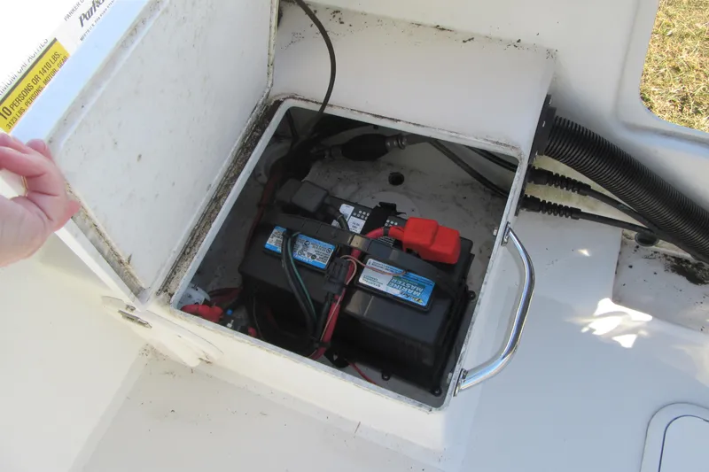 Slide: The Image of Battery compartment of a 2022 Parker 2300 Special Edition boat, showing wiring and connections. - 23