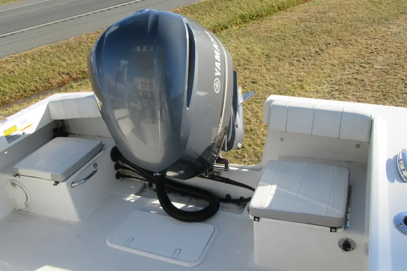 Slide: The Image of 2022 Parker 2300 Special Edition boat with Yamaha outboard motor, featuring cushioned seating. - 25
