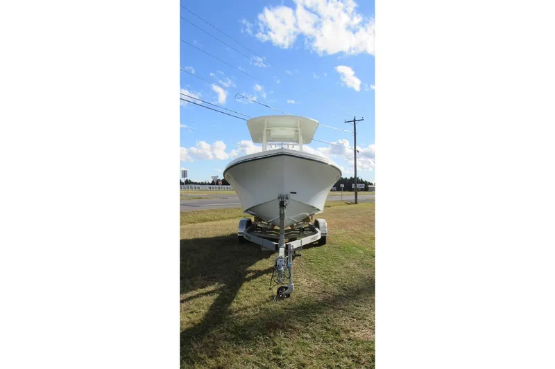 Slide: The Image of Front view of 2022 Parker 2300 Special Edition boat on trailer under blue sky. - 4
