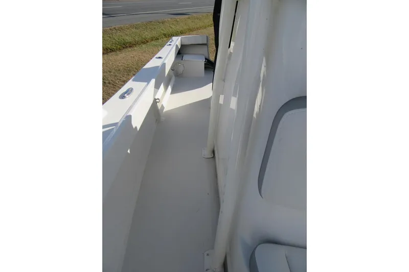 Slide: The Image of 2022 Parker 2300 Special Edition boat deck, featuring sleek white design and spacious layout. - 9