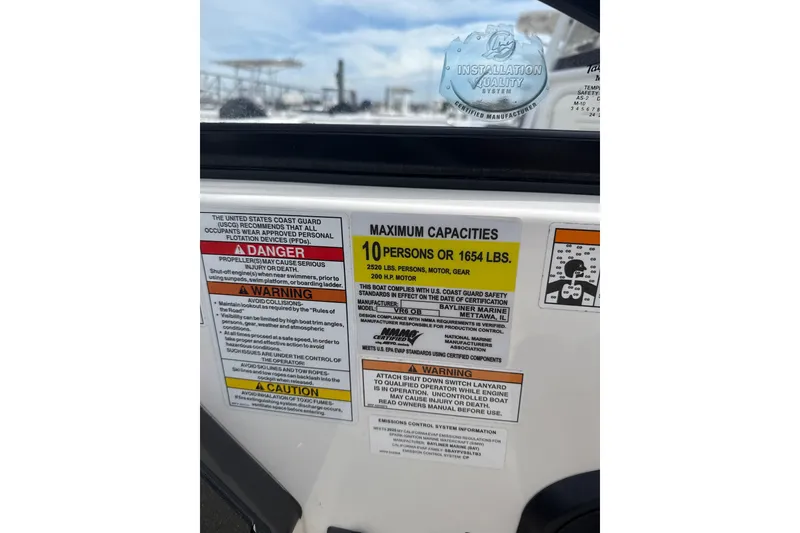 Slide: The Image of 2025 Bayliner VR6 Bowrider OB capacity warning labels, maximum 10 persons or 1654 lbs. - 7