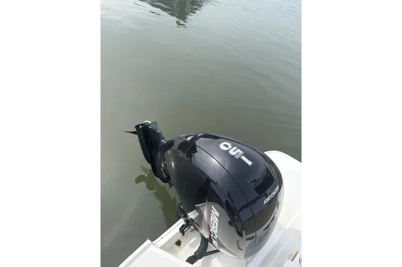 Slide: The Image of 2025 Bayliner VR6 Bowrider OB with Mercury outboard engine on calm water. - 8