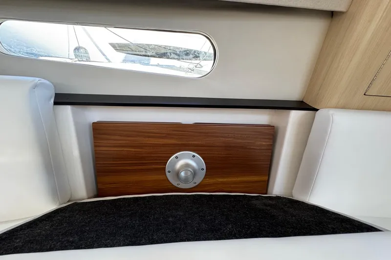 Slide: The Image of Interior of 2026 Regal 33 XO yacht with wood panel and window view. - 101