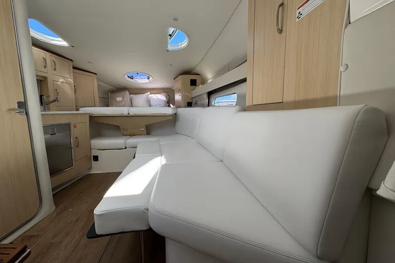 Slide: The Image of Luxurious interior of 2026 Regal 33 XO yacht with modern furnishings and natural light. - 111