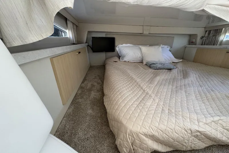 Slide: The Image of Luxurious cabin interior of 2026 Regal 33 XO yacht with cozy bed and modern decor. - 116
