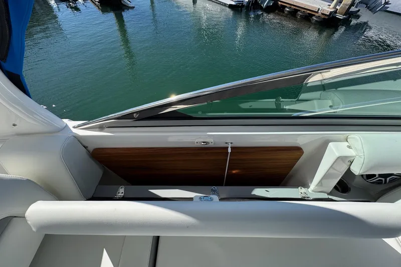 Slide: The Image of 2026 Regal 33 XO boat interior with sleek seating and water view. - 41