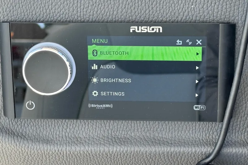 Slide: The Image of Fusion audio system display in 2026 Regal 33 XO boat, showing Bluetooth menu options. - 59