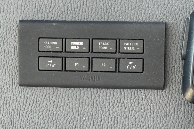 Slide: The Image of Control panel on 2026 Regal 33 XO boat with navigation buttons. - 60