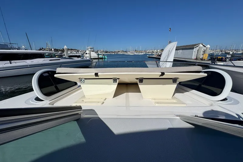 Slide: The Image of 2026 Regal 33 XO boat docked at marina, showcasing spacious deck seating. - 65
