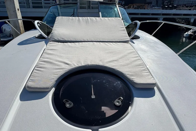 Slide: The Image of 2026 Regal 33 XO yacht with sunpad and hatch on deck. - 66