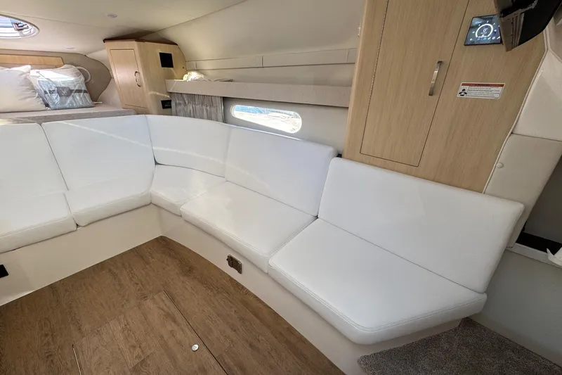Slide: The Image of Luxurious interior of 2026 Regal 33 XO yacht with white seating and wood accents. - 75