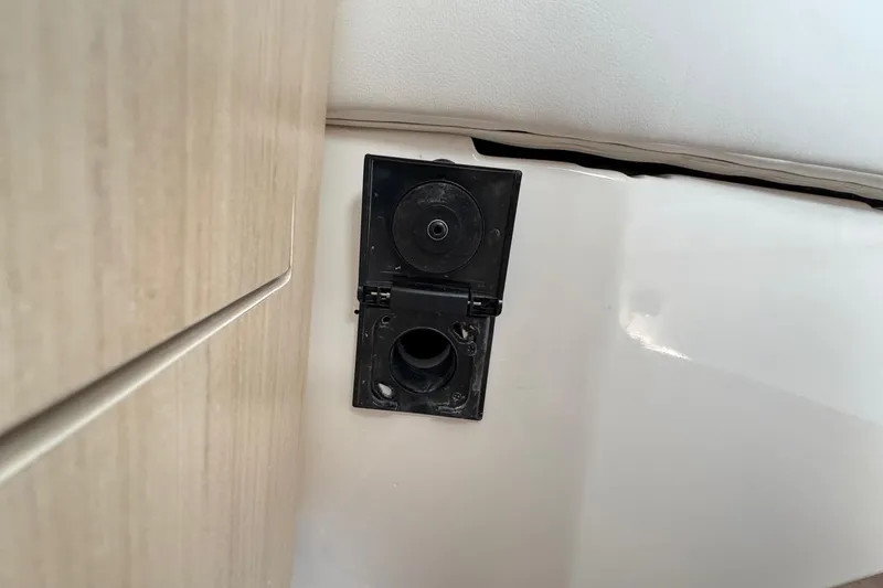 Slide: The Image of Open black hatch on 2026 Regal 33 XO boat interior. - 91