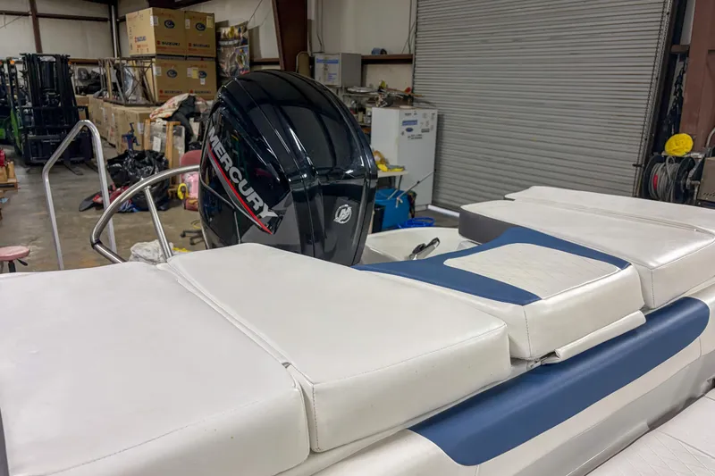 Slide: The Image of 2023 Tahoe 185 S boat with Mercury engine in a storage facility. - 9