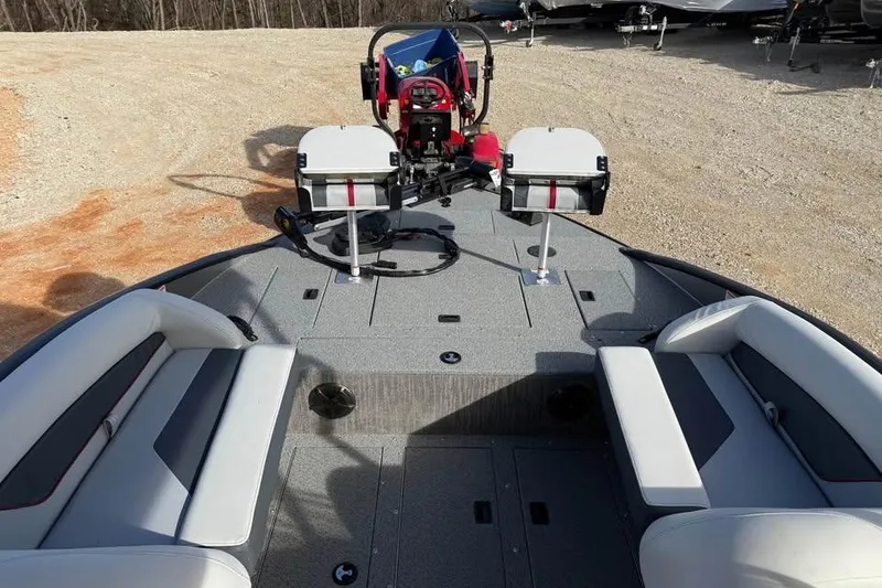 Slide: The Image of 2026 Lowe Sport Deck 224 boat interior with seating and fishing equipment. - 12