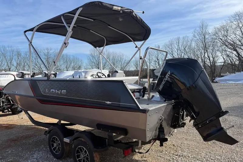 Slide: The Image of 2026 Lowe Sport Deck 224 boat with canopy and Mercury outboard motor on trailer. - 6