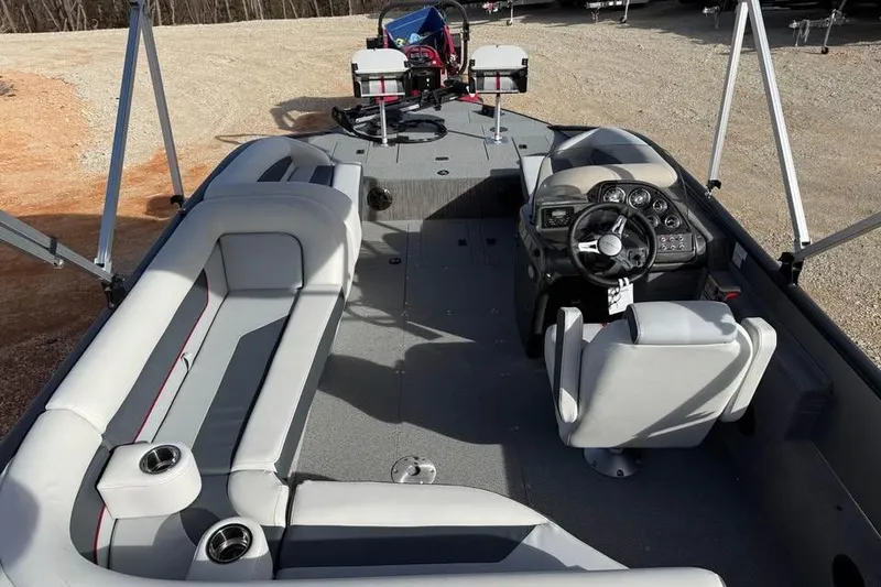 Slide: The Image of 2026 Lowe Sport Deck 224 boat interior with seating and steering console. - 8