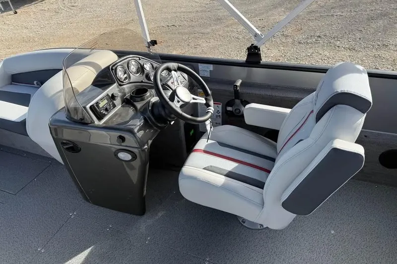 Slide: The Image of 2026 Lowe Sport Deck 224 boat interior with steering console and captain's chair. - 9