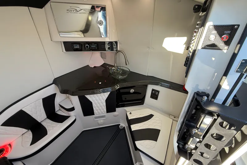 Slide: The Image of Luxurious interior of a 2021 MTI 42V boat with modern seating and sleek design. - 11