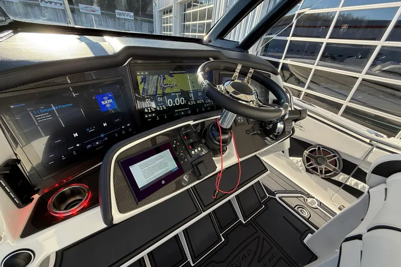 Slide: The Image of MTI 42V 2021 boat cockpit with advanced navigation and audio systems. - 15