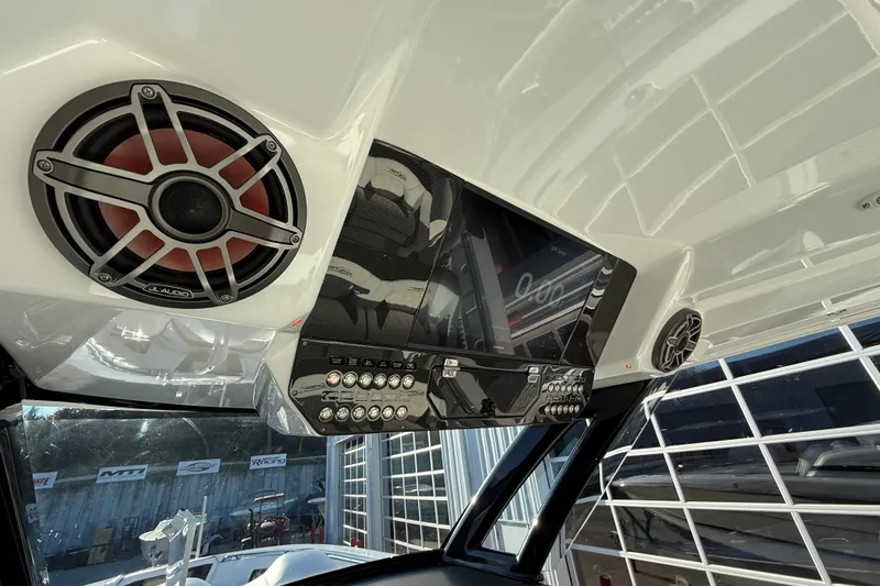 Slide: The Image of Interior of 2021 MTI 42V boat with JL Audio speakers and control panel. - 16