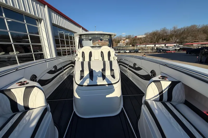 Slide: The Image of Luxury MTI 42V boat interior with sleek seating, 2021 model, docked at marina. - 23