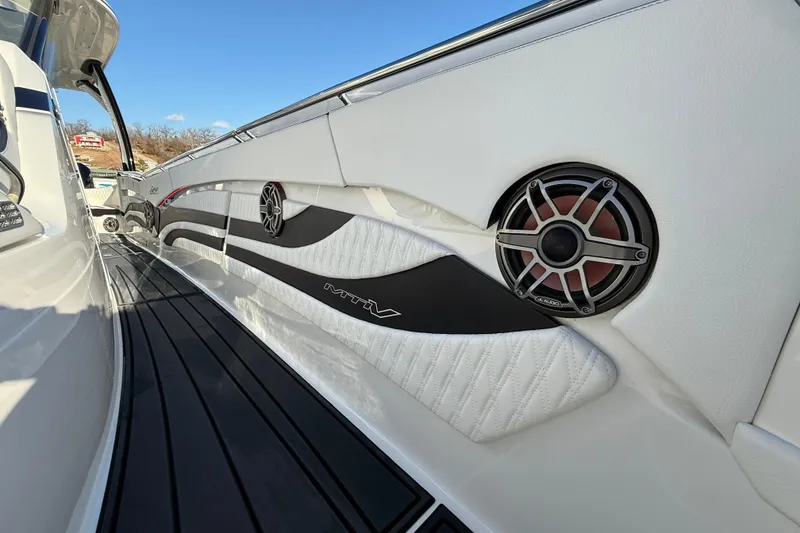 Slide: The Image of 2021 MTI 42V boat interior with sleek design and high-quality audio system. - 24