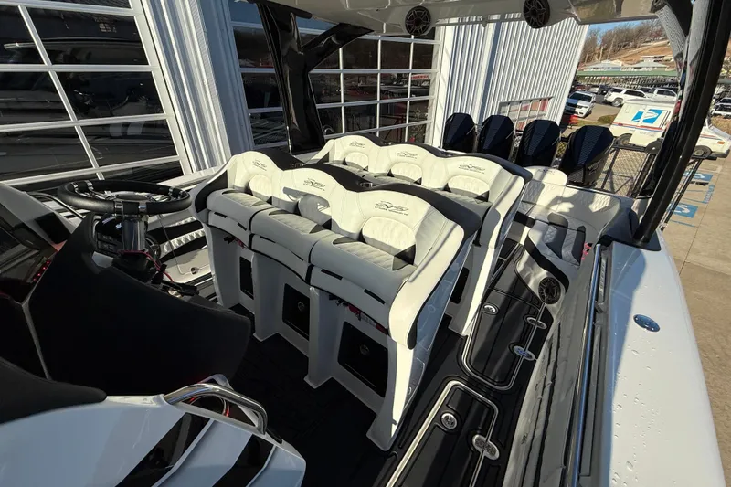 Slide: The Image of 2021 MTI 42V boat interior with white seating and modern steering console. - 31