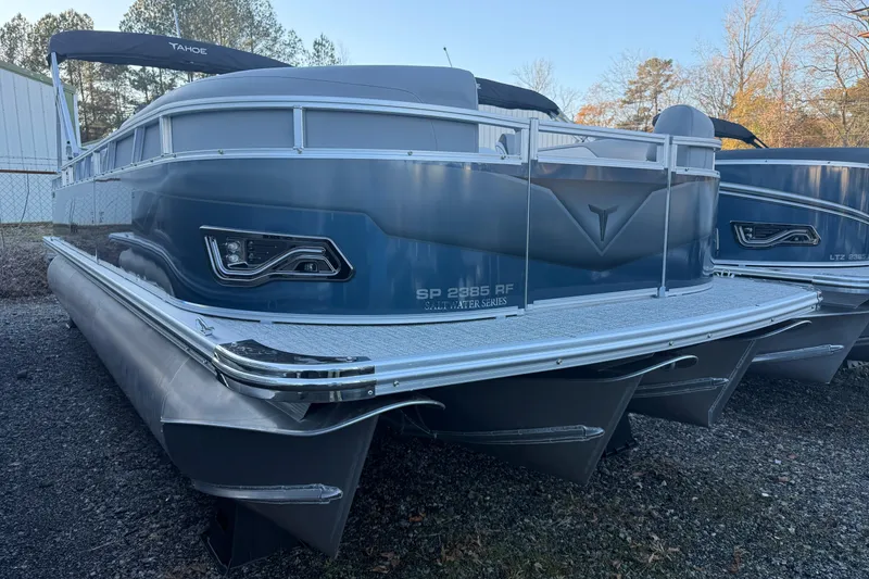 The Image of 2026 Tahoe Pontoon Sport 85 Rear Fish boat, sleek design, parked outdoors. - 0