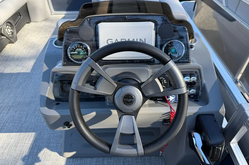 Slide: The Image of Steering console of 2026 Tahoe Pontoon Sport 85 Rear Fish with Garmin display. - 4