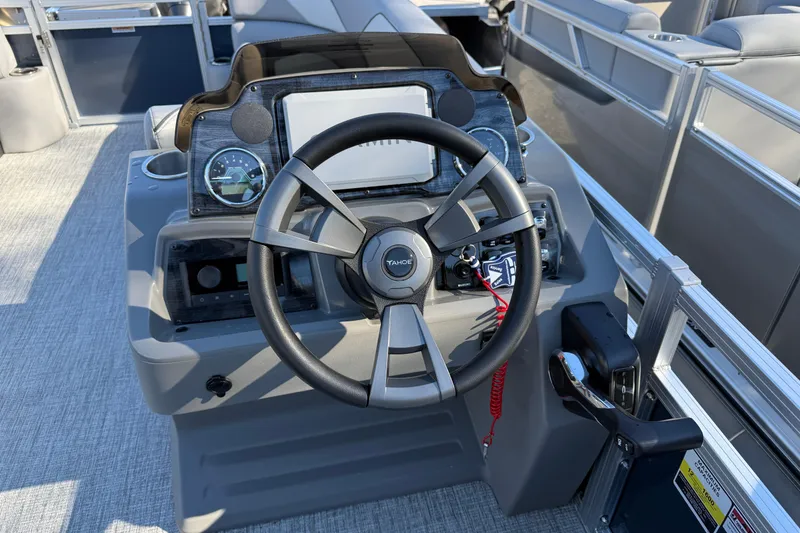Slide: The Image of 2026 Tahoe Pontoon Sport 85 Rear Fish steering console with modern controls and dashboard. - 5