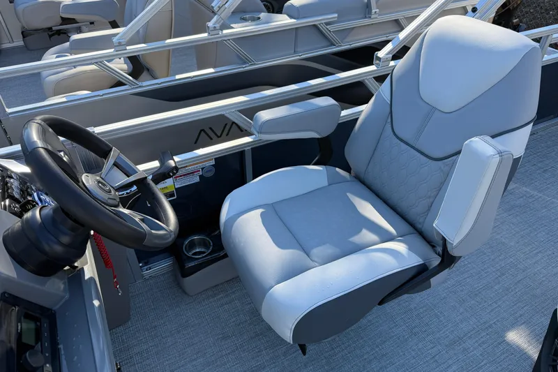 Slide: The Image of 2026 Tahoe Pontoon Sport 85 Rear Fish captain's chair and steering wheel, showcasing luxury design. - 6