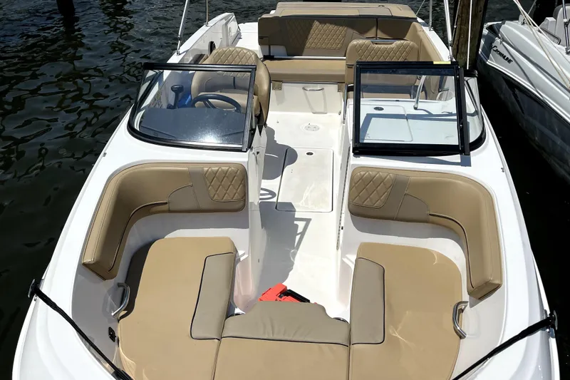 Slide: The Image of 2025 Bayliner VR6 Bowrider OB with spacious seating and modern design on the water. - 5