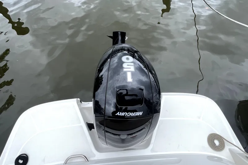 Slide: The Image of 2025 Bayliner VR6 Bowrider OB with Mercury 150 outboard motor on water. - 8