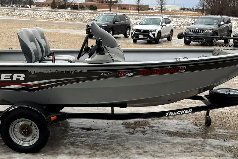 Slide: The Image of 2010 Tracker Pro Guide V-15 SC boat on trailer, parked on icy ground. - 3