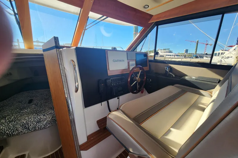 Slide: The Image of 2021 Cutwater C-32 CB boat interior with Garmin navigation system and steering wheel. - 15