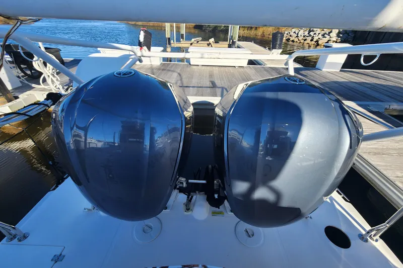 Slide: The Image of 2021 Cutwater C-32 CB boat with dual outboard engines at a dock. - 19